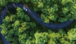 Car driving on winding road in countryside