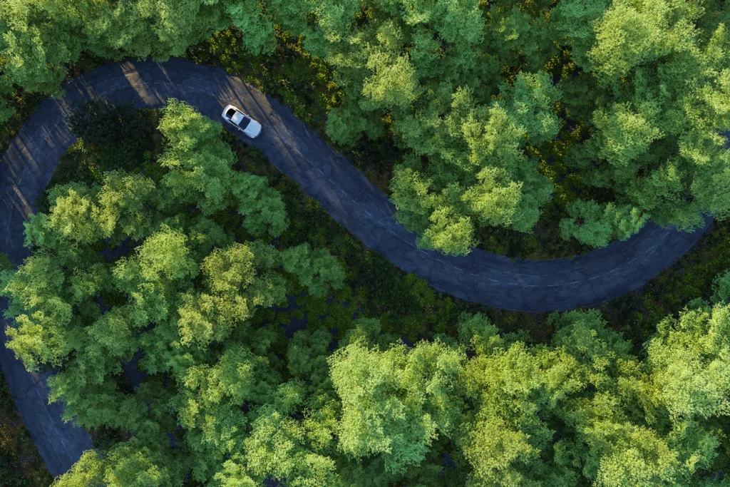 Car driving on winding road in countryside