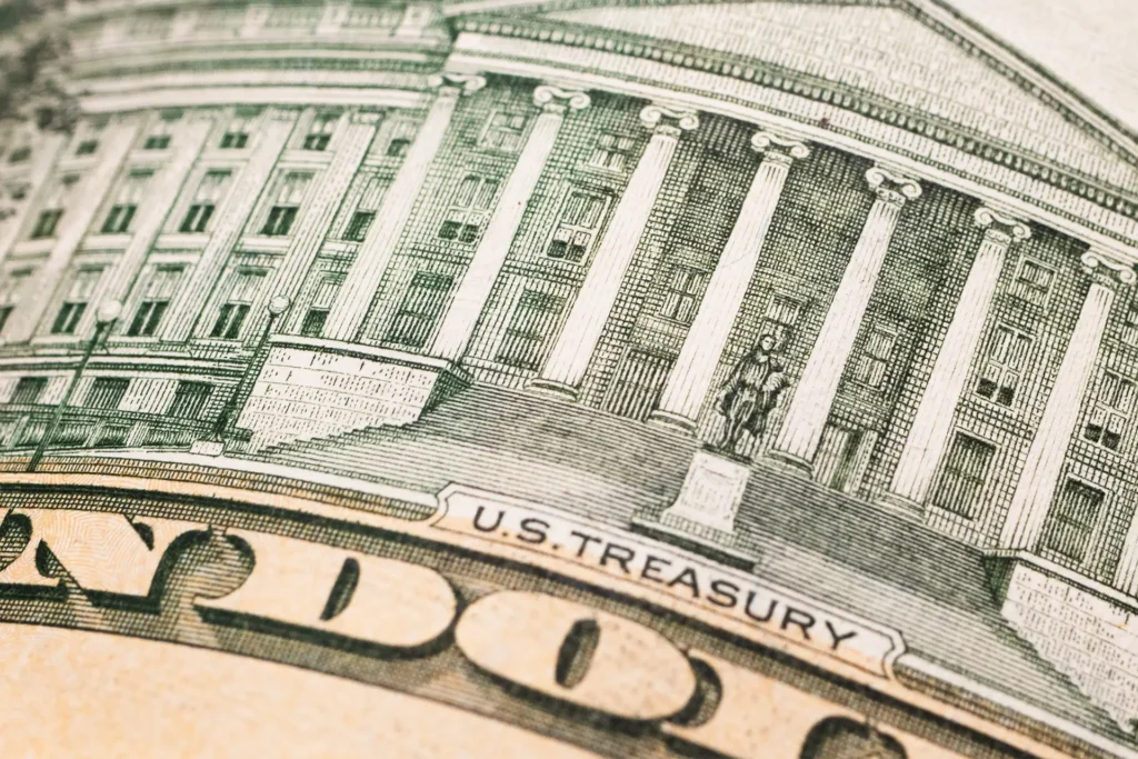Close-up of the U.S. Treasury building printed on a twenty-dollar bill.